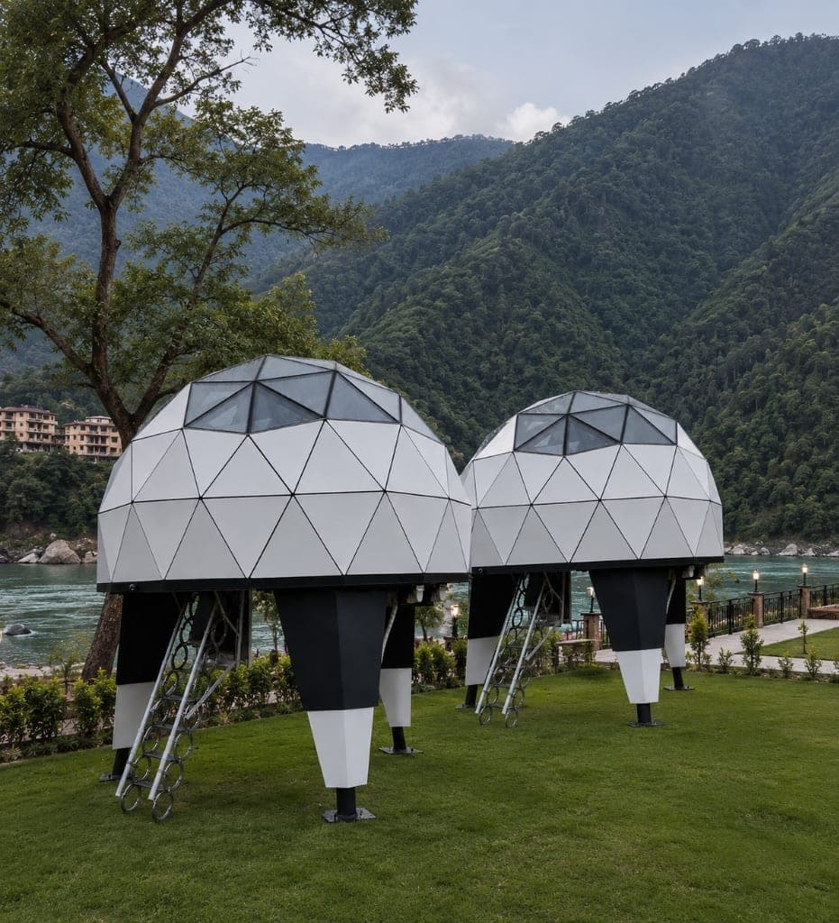 Twin NIVA D1 elevated luxury dome cabins on lawn by river valley