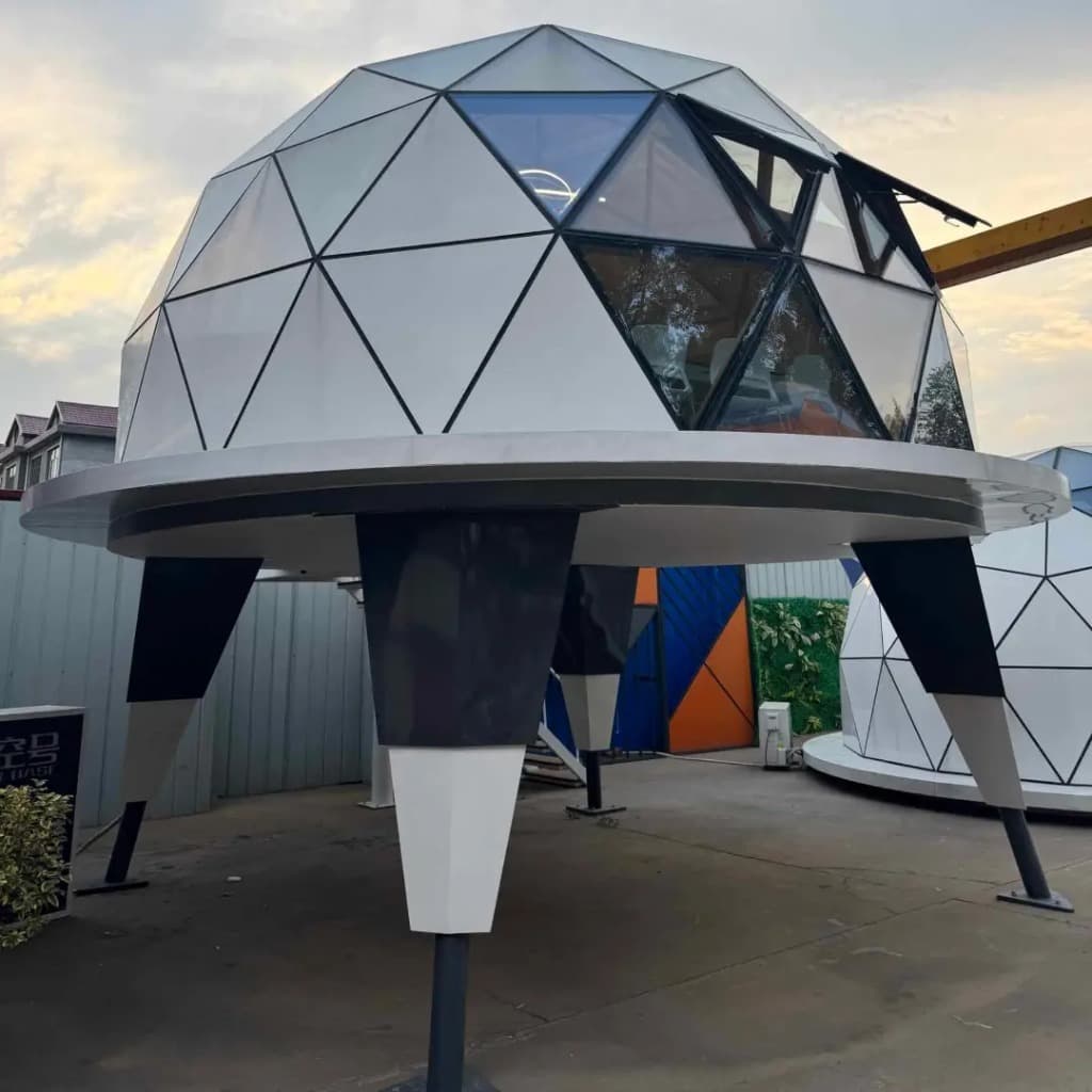 NIVA D1 luxury elevated dome cabin perched on 3 steel pillars with foldable access staircase