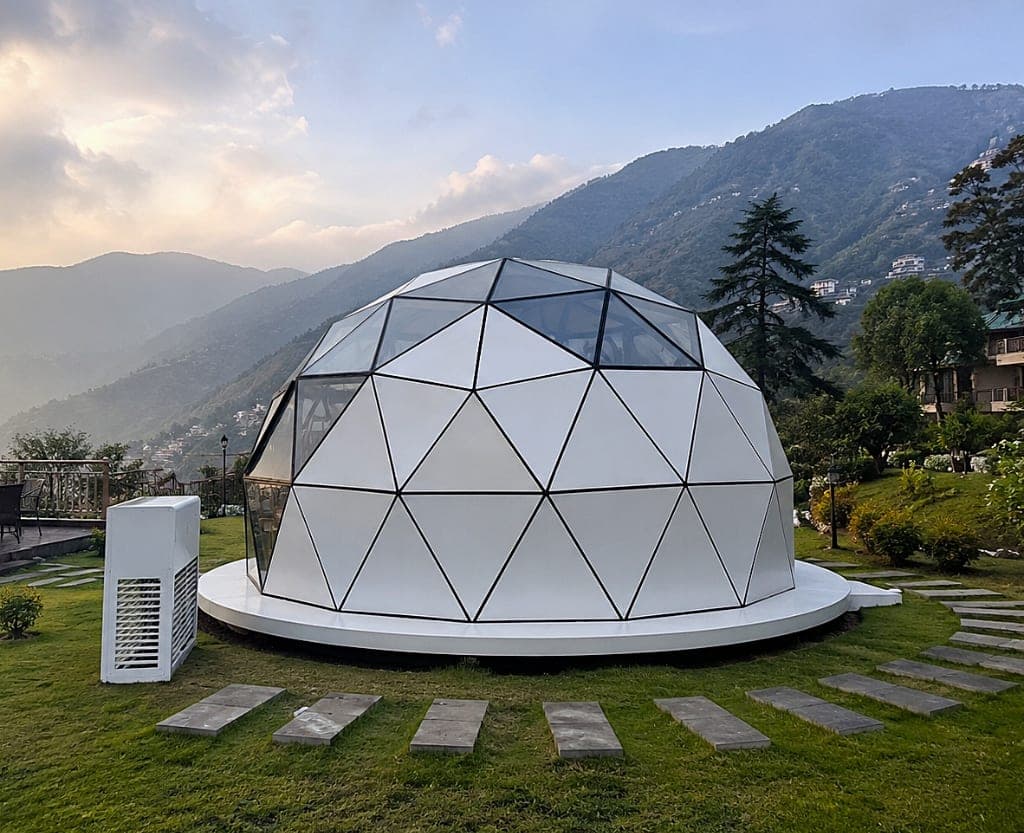 NIVA D2 grounded luxury dome cabin on mountain lawn plinth