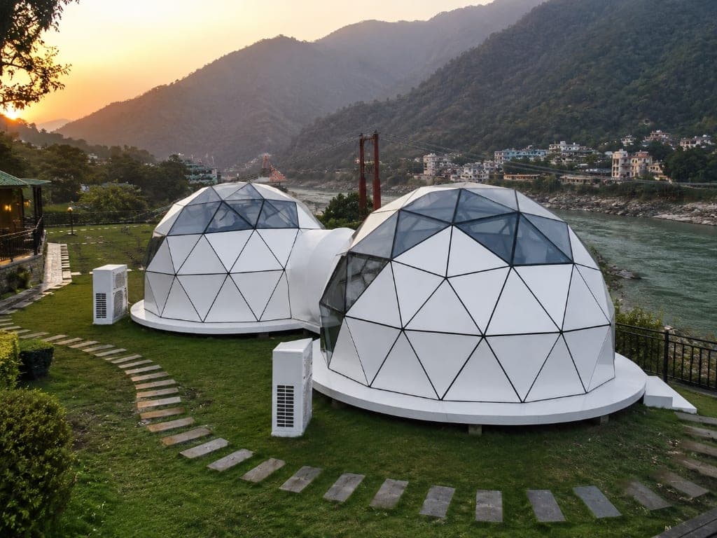NIVA D2 twin grounded luxury dome cabins on plinth deck by river valley in India